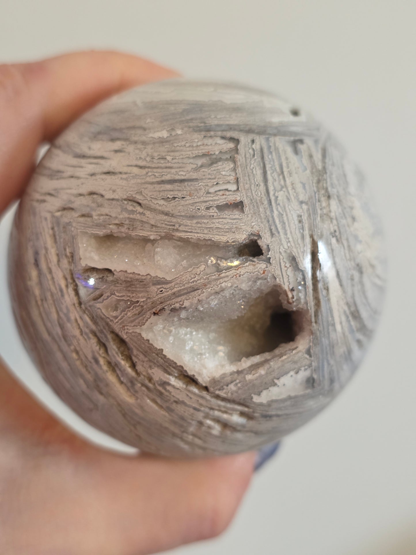 White Mexican Lace Agate Shimmering Druzy UV Reactive on stand